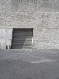 a garage door with some type of window behind it that is a car parked outside