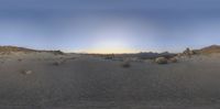 a panoramic view of a rocky landscape at sunset as seen from a pointy perspective