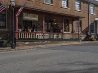 the antique shop has statues outside on its porch for visitors to see it now theres also a new street sign and light