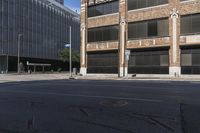 street with cars driving down it and a building behind it, and bicycle on the sidewalk