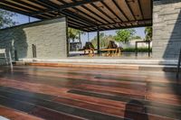 a deck in the backyard with table, chairs, and fire pit near by the pool