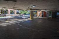 there is a parking space in this building where you can see some people and the light on