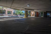 there is a parking space in this building where you can see some people and the light on