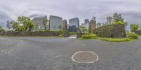 a street is shown with the skyline behind it in this 360 - panorama photo taken from the corner