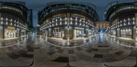 360 lens looking through a city square in the evening and there are buildings on both sides of it