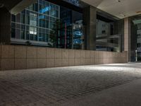 an open door at the lobby of a modern building with glass doors on either side