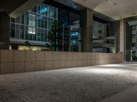 an open door at the lobby of a modern building with glass doors on either side