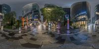 a 360 - view of buildings and other tall buildings along the city streets at night