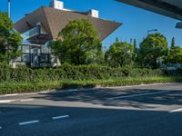 the city of richmond has long white arrows running down it's side and a pedestrian crossing over an expressway