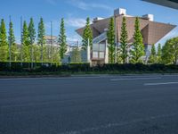 the city of richmond has long white arrows running down it's side and a pedestrian crossing over an expressway