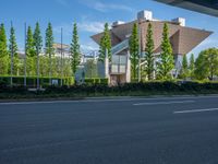 the city of richmond has long white arrows running down it's side and a pedestrian crossing over an expressway