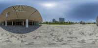 two circular photos of the outside of a building, with an area of pavement, in front of it