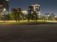 city street with a wide assortment of buildings in the background and cars moving through it