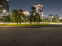 city street with a wide assortment of buildings in the background and cars moving through it