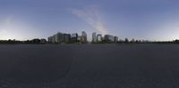 the city skyline seen through the street lens on a skateboarder's perspective