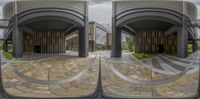 the inside of a building with multiple circular mirrors showing off the outside of it with a building in the background