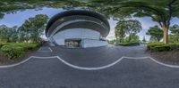 a 360 - camera view of the entrance to a building with many trees around it