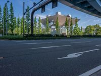 the city of richmond has long white arrows running down it's side and a pedestrian crossing over an expressway