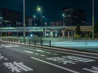 an image of outside of the night time building with the lights turned on and the streets empty