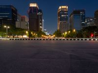 city street with a wide assortment of buildings in the background and cars moving through it