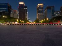 city street with a wide assortment of buildings in the background and cars moving through it