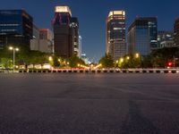 city street with a wide assortment of buildings in the background and cars moving through it