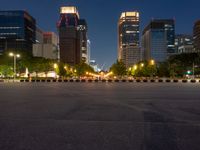 city street with a wide assortment of buildings in the background and cars moving through it