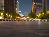 city street with a wide assortment of buildings in the background and cars moving through it