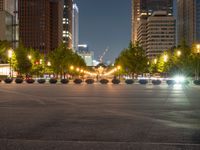 city street with a wide assortment of buildings in the background and cars moving through it