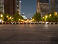 city street with a wide assortment of buildings in the background and cars moving through it