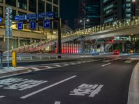 an image of outside of the night time building with the lights turned on and the streets empty