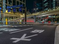 an image of outside of the night time building with the lights turned on and the streets empty