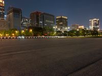 city street with a wide assortment of buildings in the background and cars moving through it