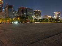 city street with a wide assortment of buildings in the background and cars moving through it