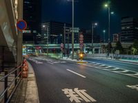 an image of outside of the night time building with the lights turned on and the streets empty