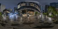 a city is shown through the fish eye lens on this angle to see a street with lights on