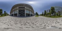 a fisheye lens with some circular shapes in the foreground and an office building