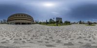 360 - zoom of the exterior of a large building with a circular pattern outside the building