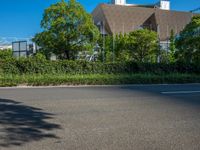 the city of richmond has long white arrows running down it's side and a pedestrian crossing over an expressway