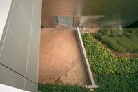 an overhead picture of a concrete stairs and some grass with a sky background on top of it