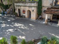 an aerial picture of a small courtyard in a village in the mediterranean region of turkey