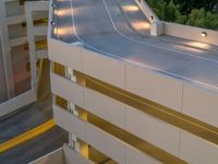 a view of a road and an overpass with traffic passing through it by buildings