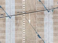 parking lots from a high vantage in a parking lot with lines pointing out to cars