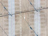 parking lots from a high vantage in a parking lot with lines pointing out to cars