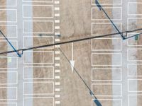 parking lots from a high vantage in a parking lot with lines pointing out to cars