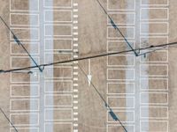 parking lots from a high vantage in a parking lot with lines pointing out to cars