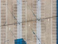 parking lots from a high vantage in a parking lot with lines pointing out to cars