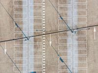 parking lots from a high vantage in a parking lot with lines pointing out to cars