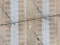 parking lots from a high vantage in a parking lot with lines pointing out to cars