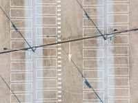 parking lots from a high vantage in a parking lot with lines pointing out to cars